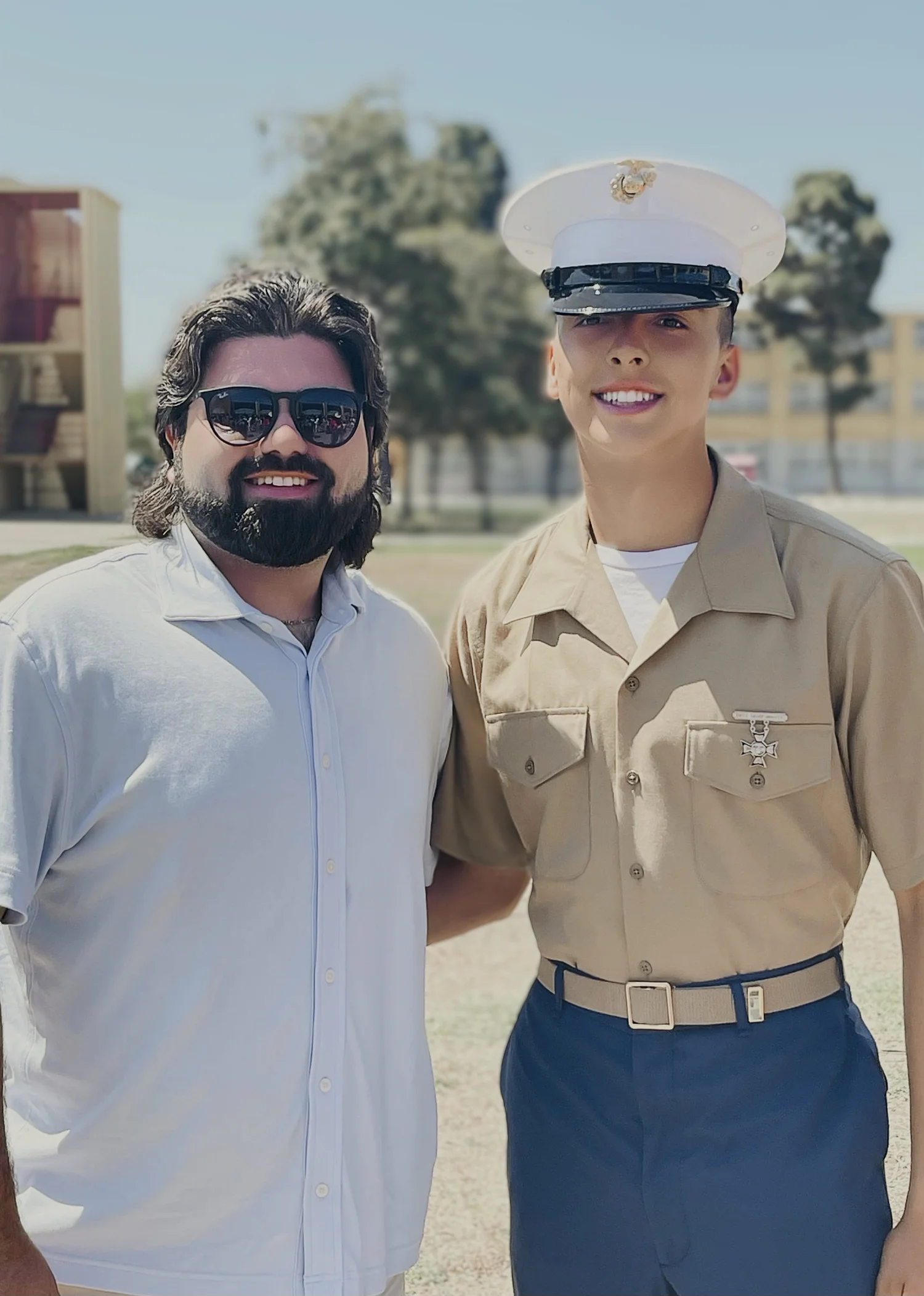 Aaron Clite with a family member in uniform